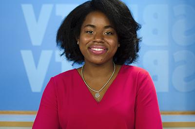 Female student at the SBU-TV news anchor desk.